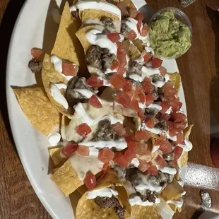 Nachos, steak, Mike salsa, queso, and guacamole!