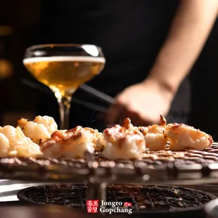 a plate of food and a glass of wine