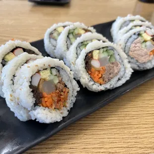 Modern Kimbap combo with 3 different items: kimchi, bulgogi, and tuna