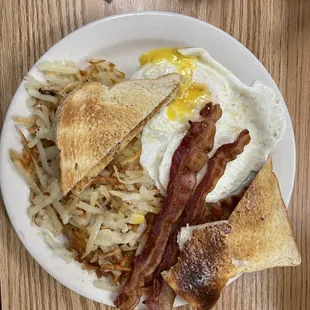 2 Eggs , Hash Browns , Choice of Meat and Toast