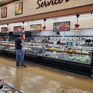  man standing in front of a deli