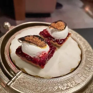 Raspberry charcoal merengue bite