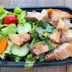Crispy Pork Belly over rice.