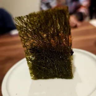 Makgeolli- makgeolli bread, eel, sweet corn, and gamtae bugak. Excellent course. One of the best