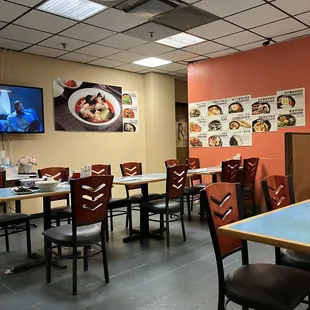 a restaurant with tables and chairs
