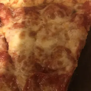 a slice of pepperoni pizza