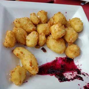 Cheese curds with blueberry sauce.