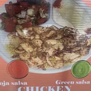 a plate of chicken and vegetables