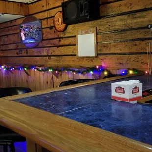 a bar with a blue counter top
