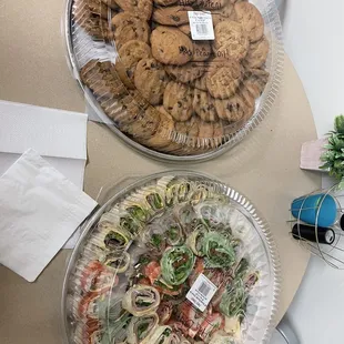 two plates of cookies on a table