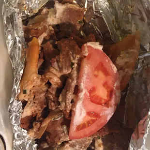 What&apos;s left of my spicy gyro. You get your $6.99 worth. Lots of meat and super messy.