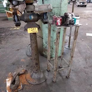 A metal Grinder on a Pedestal Base