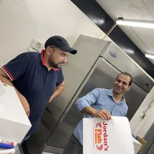 two men in a kitchen
