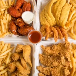 four trays of food