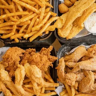 three baskets of fried fish and fries