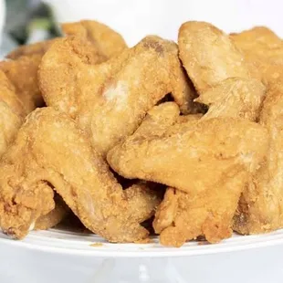 a plate of fried fish and wings