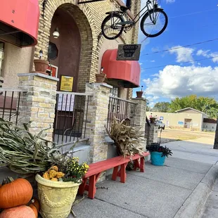 a bicycle and pumpkins