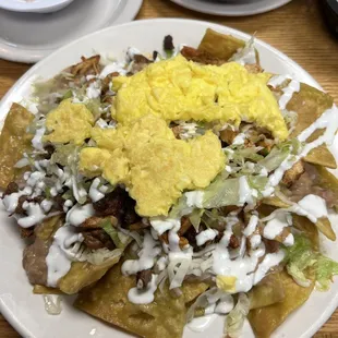 Chilaquilles verdes with steak and chicken. So good!