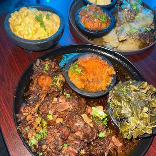 Oxtail, with candied yams and okra. Along with beef short ribs accompanied by candied yams and mashed potatoes.