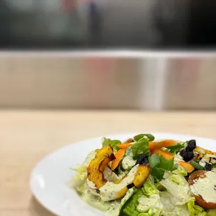 a plate of salad on a table
