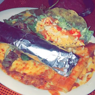 a plate of food with a burrito
