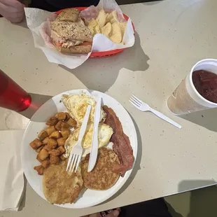 The turkey Panini And the regular breakfast plate  with water and purple rain tea