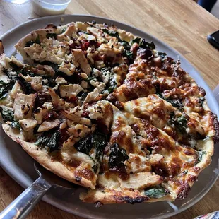chicken, spinach, and cheese pizza