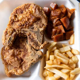 Potk chops ( 2 ) with sweet potatoes and fries