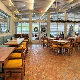 a dining area with tables and chairs