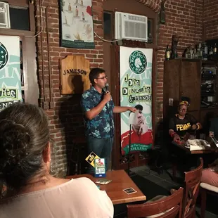 a man standing in front of a microphone