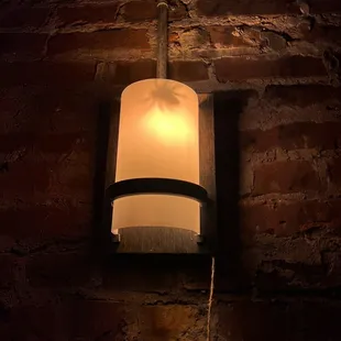 a brick wall and a light fixture