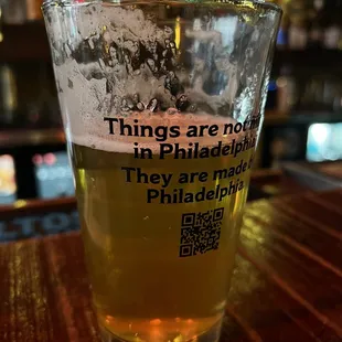 a pint of beer on a bar