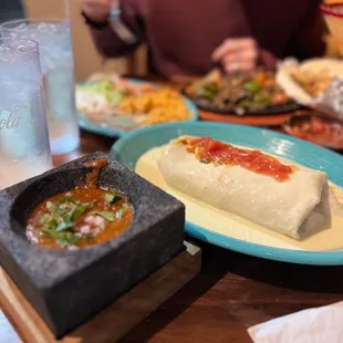 Burrito California with white queso, house made hot suace &amp; fajitas