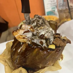 a plate of food and a knife