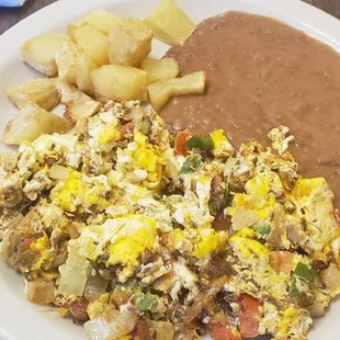 Machacado con nuevo, papas y frijoles. $5.99