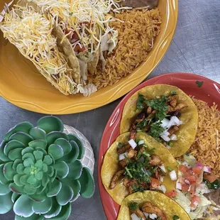 Three crispy tacos and tacos al pastor with rice and beans
