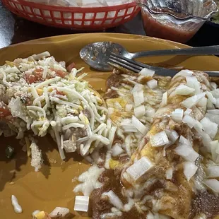 Bean and cheese chalupa and cheese and onion enchiladas with carne sauce.