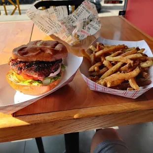 a burger and fries on a table