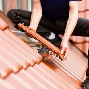 a man fixing a roof