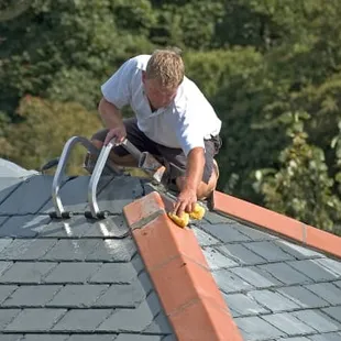 a man working on a roof