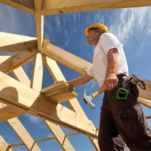 a construction worker working on a roof
