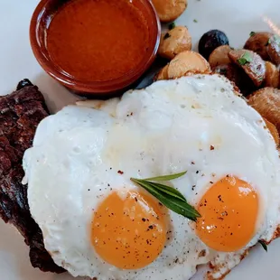 Steak and Eggs with potatoes and chimichuri sauce