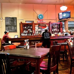 people sitting at tables in a restaurant