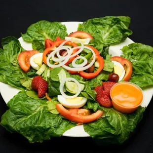 House Salad - Served with tossed greens, carrots, and tomatoes.