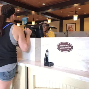 a woman standing at the counter