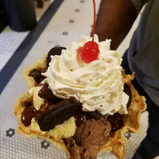 an ice cream sundae with a cherry on top