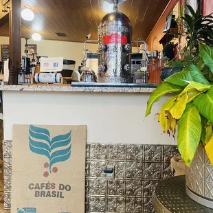 a coffee shop counter with a sign that says cafe do brasil