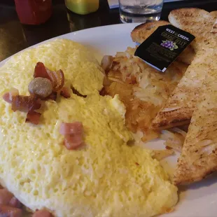 3 meat omelet w/hash browns and sourdough toast.