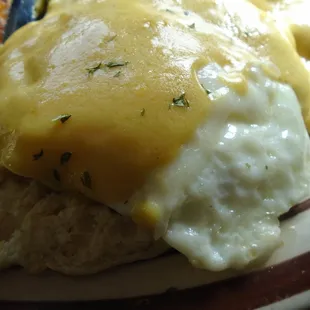 Eggs benedict with sausage, close-up.