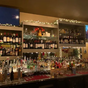 a bar with many bottles of wine